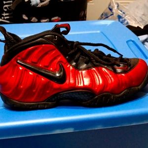 Red and black Nike foam posited. Size 8.